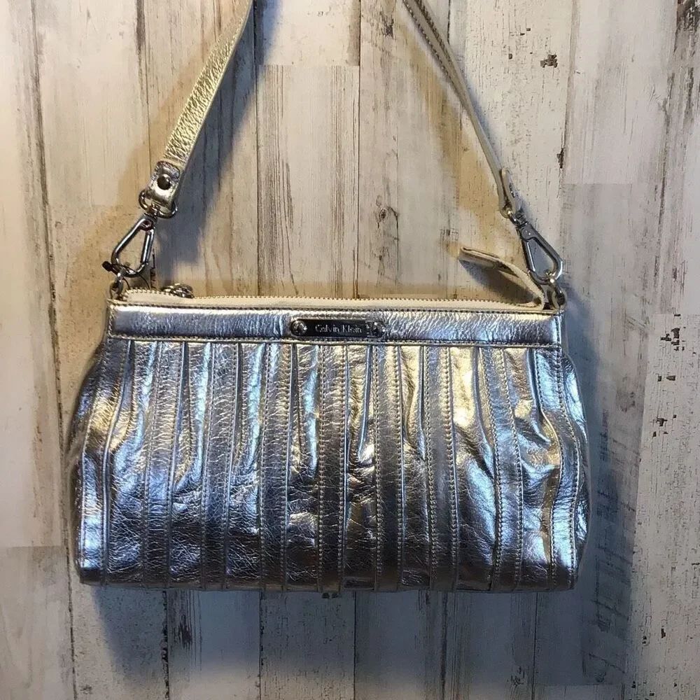 Sweet little silver, Calvin Klein purse from Macy’s. New with tags.